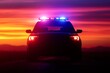 A police car illuminated by bright lights against a stunning sunset backdrop, creating a dramatic scene.