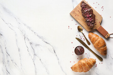 Wall Mural - Sweet croissants with chocolate spread on white background