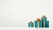 © herman - Three beautifully wrapped teal gifts with golden ribbons placed on a clean white background
