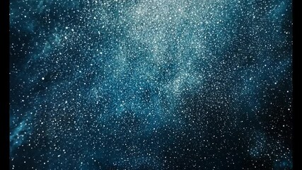 sparkling cosmic dust and stars in a dark blue night sky.
