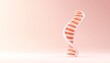 © ZTA - Abstract representation of a DNA helix on a soft pink background, symbolizing genetics and biology