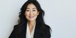 © VALUEINVESTOR - A portrait of an Asian woman in professional attire, smiling warmly at the camera with long hair and fair skin against a white background, generative AI