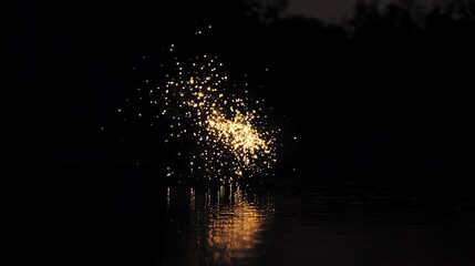 Canvas Print - Glowing sparks reflected in dark water at night.