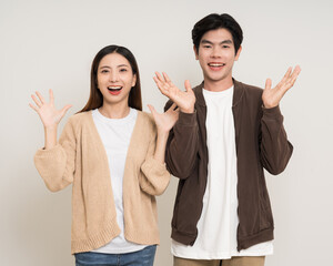 Wall Mural - Happy asian couple attractive in various action gesture standing on isolated white background. Cheerful Smiling young man and woman