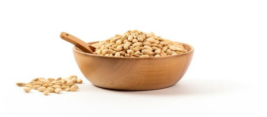 Aufkleber - Wooden bowl overflowing with beige raw dried beans positioned on a clean white background with a wooden spoon nearby and scattered beans for copy space