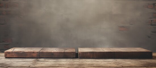 Fototapete - Vintage close-up of two worn wooden bricks on a textured concrete floor with a neutral gray backdrop and ample copy space for text.