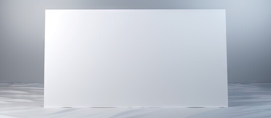 Leinwandbilder - Glossy white sheet of paper folded into sixteen sections placed on a soft gray background, offering ample blank space for text or images.