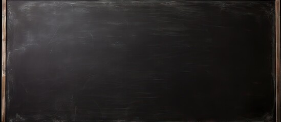 Leinwandbilder - Black chalkboard background with a wooden frame at the top and bottom. No writing or drawings, creating a clean and minimalistic appearance.