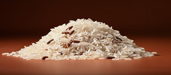Aufkleber - White basmati rice mound with brown backdrop, scattered grains in foreground, warm earthy tones create a cozy and inviting kitchen atmosphere.