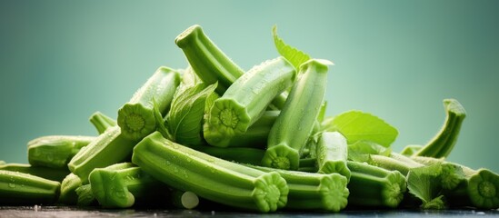 Aufkleber - Fresh vibrant green celery stalks piled against a soft gradient mint background with delicate green leaves accentuating the arrangement.