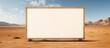 © meristock - Blank wooden message board in a vast desert landscape under a blue sky with scattered clouds, providing ample copy space for text or graphics.