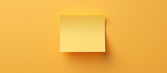 Leinwandbilder - yellow sticky note centered on a soft yellow background with ample white copy space for notes or rem