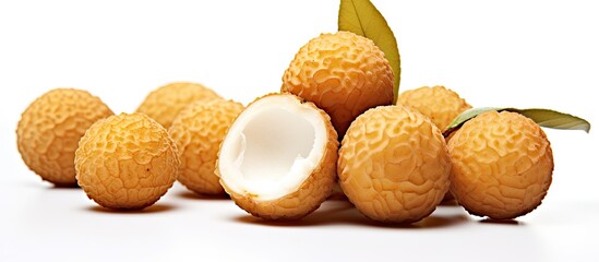 Poster - Fresh longan fruit displayed on a clean white background with vibrant yellowish-brown exterior and creamy white interior, showcasing natural textures.
