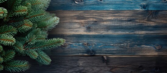 Aufkleber - Rustic wooden background featuring dark and light brown tones complemented by fresh green pine branches on the left side creating a natural feel.