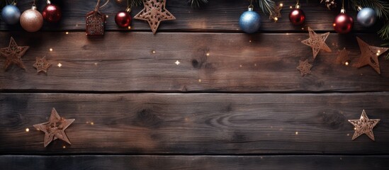 Wall Mural - Festive Christmas decorations including ornaments and stars in gold silver and red colors beautifully arranged against a rustic wooden background.