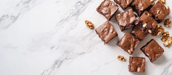 Poster - Brownies with nuts and cocoa arranged on white marble background showcasing rich textures and enticing presentation with warm brown tones and highlights
