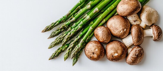 Poster - Vibrant green asparagus spears with fresh brown mushrooms arranged on a pure white background for a colorful culinary composition.