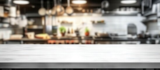 Aufkleber - Spacious blurred kitchen interior with a white empty table in the foreground offering ample copy space for product showcasing and display.