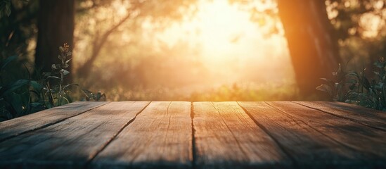 Fototapete - Wooden table in foreground bathed in warm sunlight with blurred magical forest background at sunrise, creating an enchanting atmosphere
