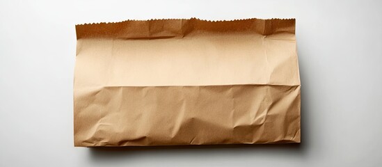 Poster - Realistic flat brown paper bag on a crisp white background featuring a folded design centered in the image suitable for creative applications