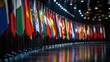 © Theraphol - A vibrant display of various national flags arranged in a row, symbolizing unity and international representation under bright lights.