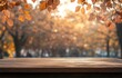 © ANUAR - Autumn Scene with Golden Leaves and Empty Wooden Table in a Soft Focus Park Background, Perfect for Seasonal Templates and Fall-Themed Designs