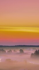 Wall Mural - Aerial View Flight Above Amazing Misty Plain Landscape. Morning Sun Shines On Plain. Sunrise Sky Timelapse. Amazing Effects Of Morning Sunrise. Sunlight Shining Through Clouds. Morning Fog Covers