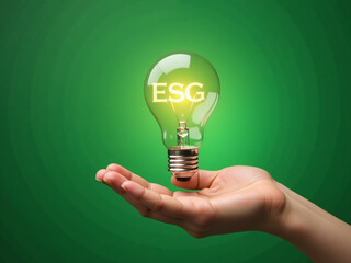 Poster - A Hand Holds A Light Bulb With An Esg Icon On A Green Background To Represent Sustainability And Ethics In Business Networking. 00001