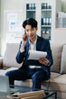 © NINENII - Male businessman talk mobile phones and working on laptop computers, online business, work from home, teleworking concept.