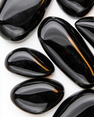 Poster - Polished obsidian stones macro shot black surface modern environment bold reflections