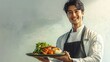 © Lush Diaries - Smiling male chef presents a delicious-looking dish.