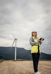 Poster - A Professional Woman Dressed in Safety Gear at a Wind Farm Actively Engaging in the Renewable Energy Sector to Contribute to a Sustainable Future and Promote Environmental Awareness