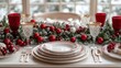 © Prasojo - Festive Christmas table setting with red and gold decorations.