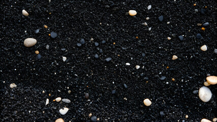 Wall Mural - black gravel background with small pebbles, close-up view