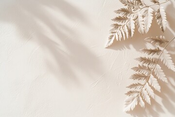 Poster - Delicate fern leaves create soft shadows on a neutral beige wall, enhancing the minimalist aesthetic. The light plays beautifully across the surface, inviting creativity