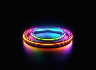 Poster - Two vibrant, glowing rainbow rings rest on a reflective surface against a stark black backdrop.  The inner ring is smaller, creating a visually striking contrast.
