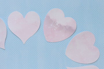 Wall Mural - decorative pink paper hearts on blue paper with dots