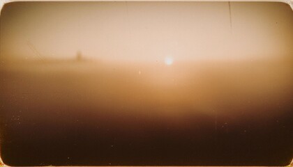 Wall Mural - vintage distressed abstract old photo of foggy sunrise, film grain, dust and scratches texture effec