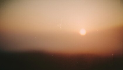 Wall Mural - vintage distressed abstract old photo of foggy sunrise, film grain, dust and scratches texture effec