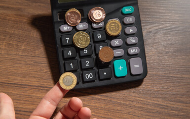 Wall Mural - Coins with calculator. Business. Finance