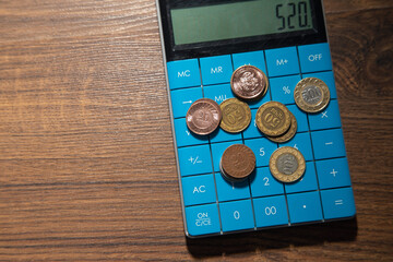 Wall Mural - Coins with calculator. Business. Finance