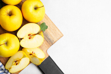 Wall Mural - Ripe yellow apples on light grey table, top view. Space for text