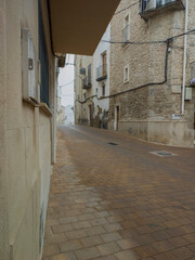 Wall Mural - stone houses and streets on a foggy day; narrow street in the old town; 