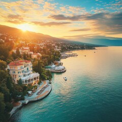 Wall Mural - Aerial view of the beautiful seafront in Opatija, Adriatic sea coast, Croatia. Opatija resort town and Lungomare sea walkway aerial view, Kvarner bay of Croatia at sunrise. Luxury travel destination 