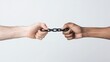 © khonkangrua - Two Hands Grasping a Chain Symbolizing Strength and Unity in Overcoming Challenges and Obstacles