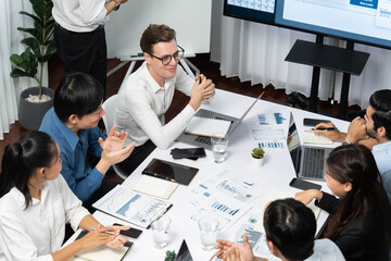 Leinwandbilder - Project manager communicate and collaborate with team using project management software display on monitor, tracking progress of project task and making schedule plan at meeting table. Prudent