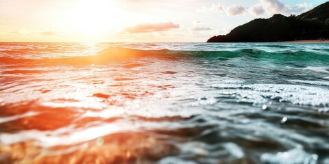 Wall Mural - Sunlit ocean waves at sunset with scenic horizon and distant hills