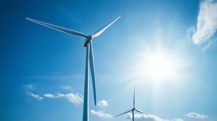 Poster - close-up of wind turbine with bright sun and blue sky, showcasing clean energy and the power of rene
