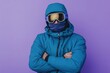 © Ева Поликарпова - A person wearing a blue jacket and goggles stands with their arms crossed, ready for an adventure