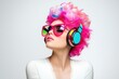 © Karat - A vibrant woman with bright pink hair, colorful headphones, and oversized sunglasses, exuding a bold and creative style on a minimalist white background.